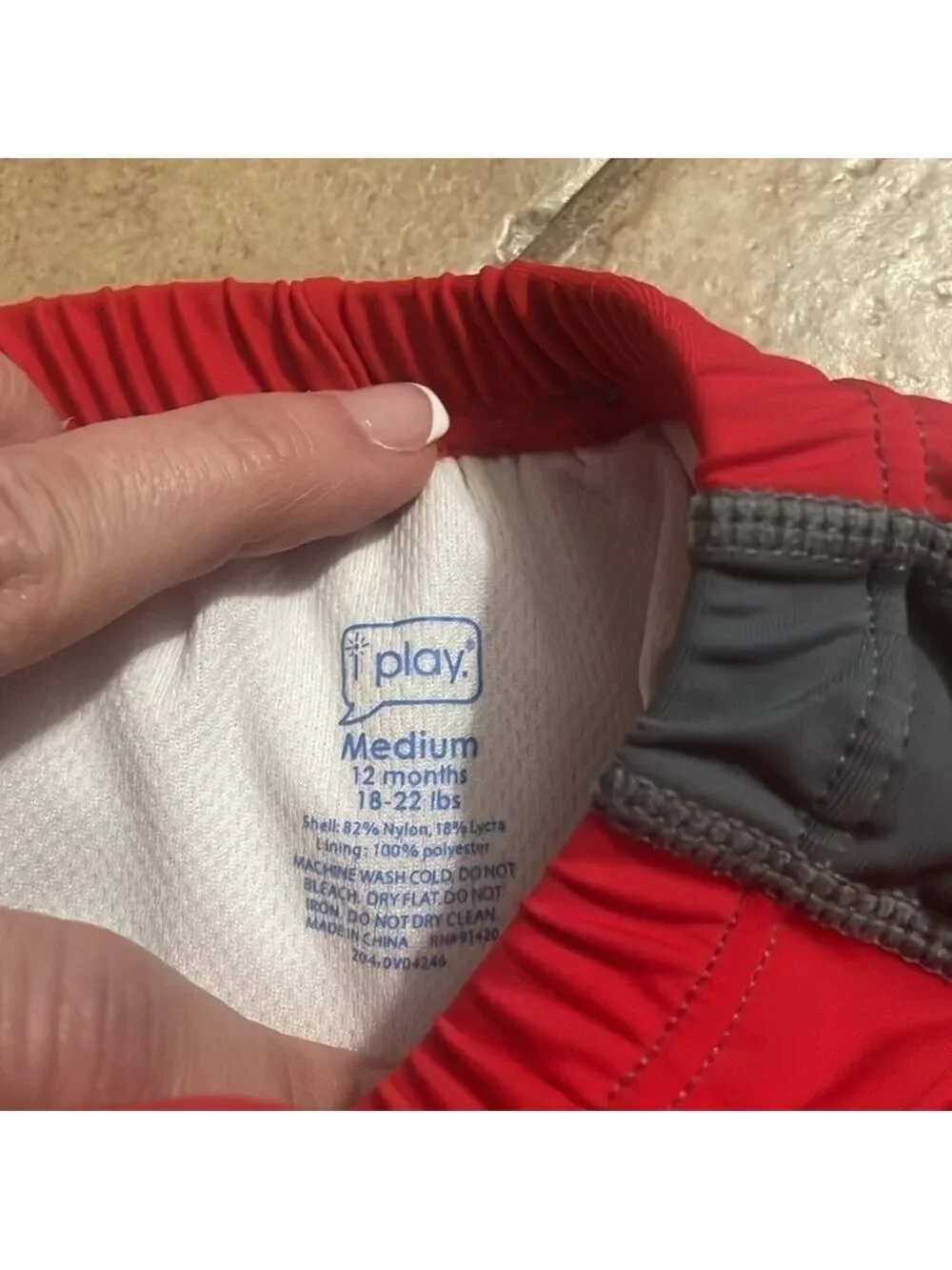 I play boys shark swim shirts and shirt size 12 months